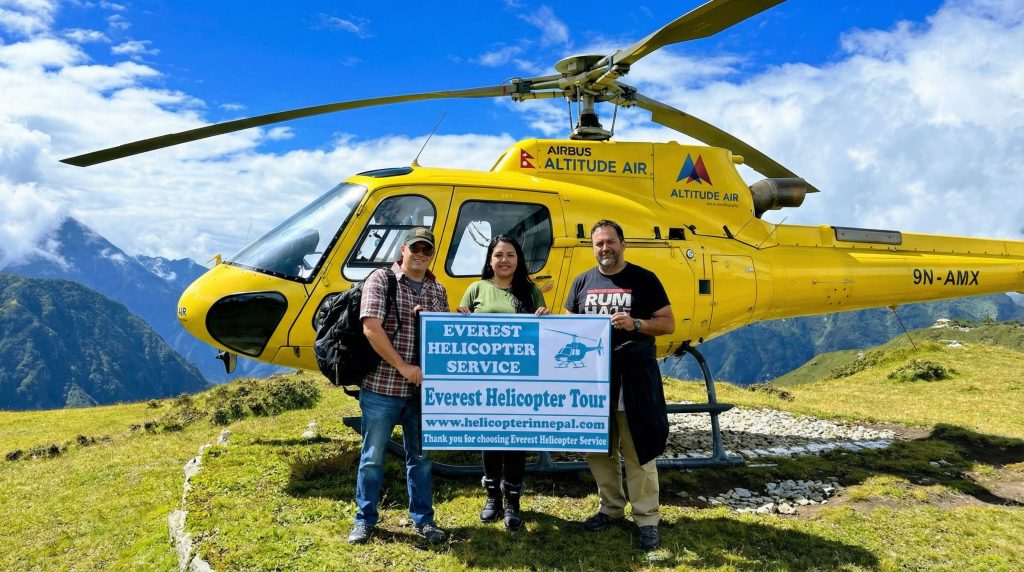 Guests at Everest and behind them is helicopter-Everest Helicopter Service (1)
